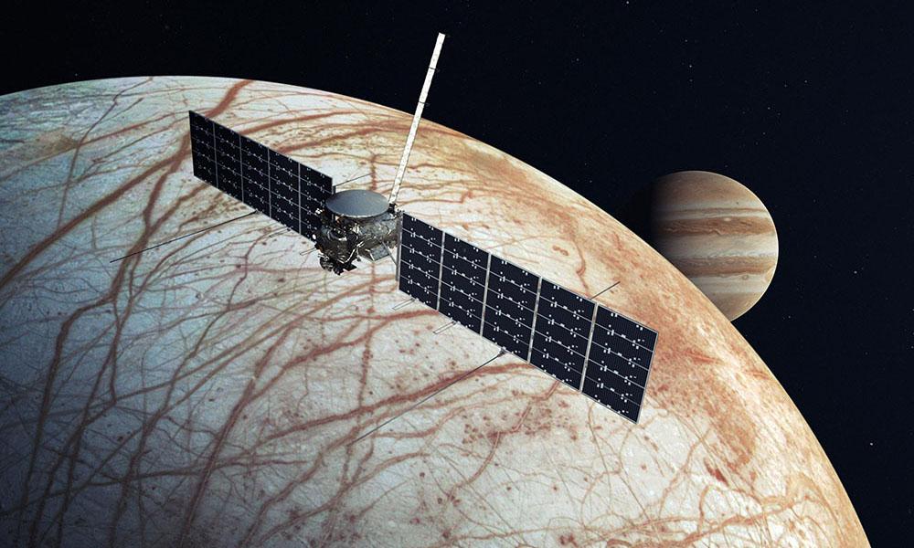 Artist's rendering of Europa Clipper Spacecraft flying over a Jupiter's Europa moon.